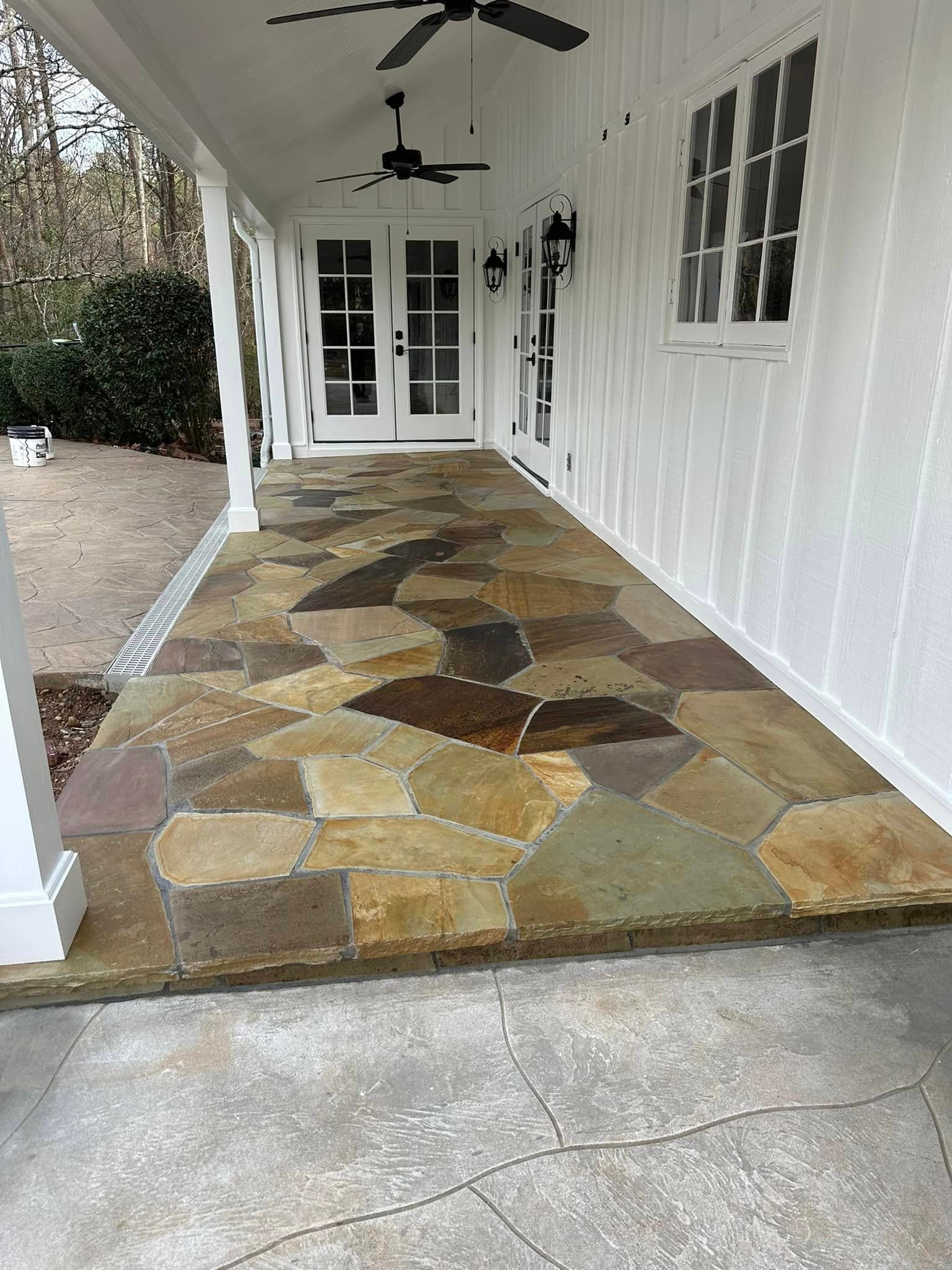 Front entry with custom iron-and-glass doors