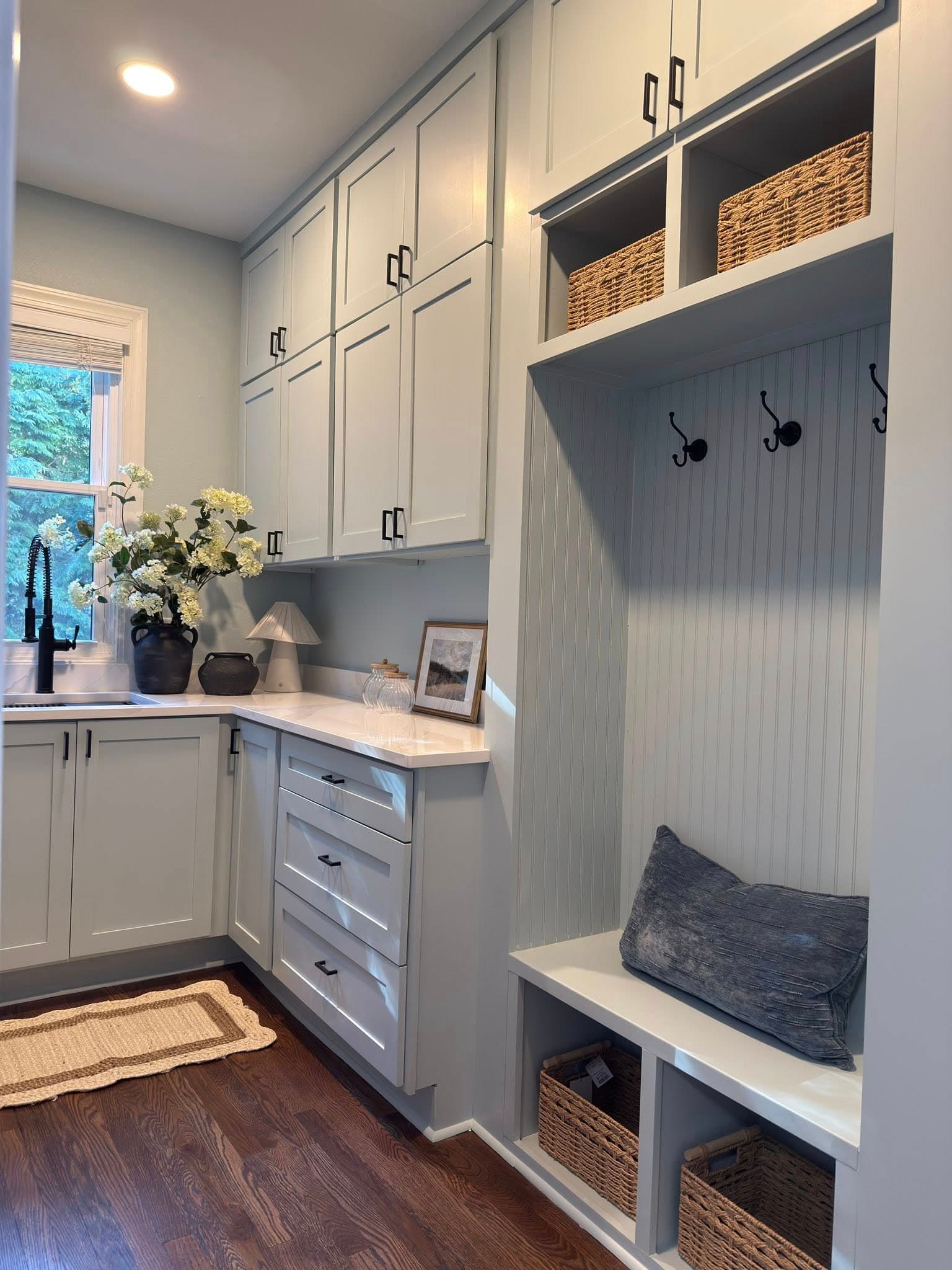 Custom mudroom with shaker cabinets and woven baskets